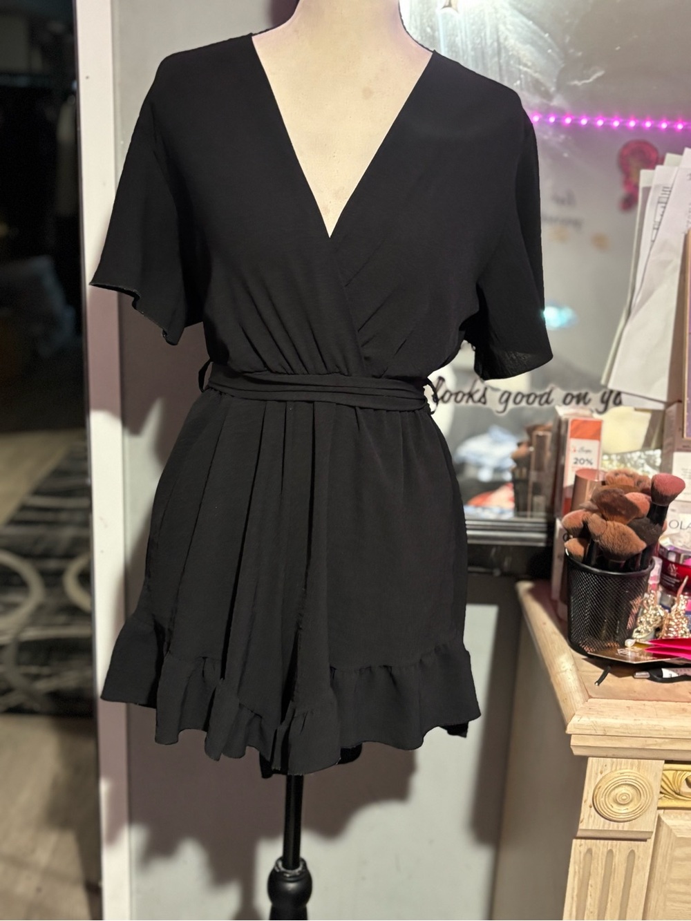 Black Wrap-Front Ruffle Hem Romper